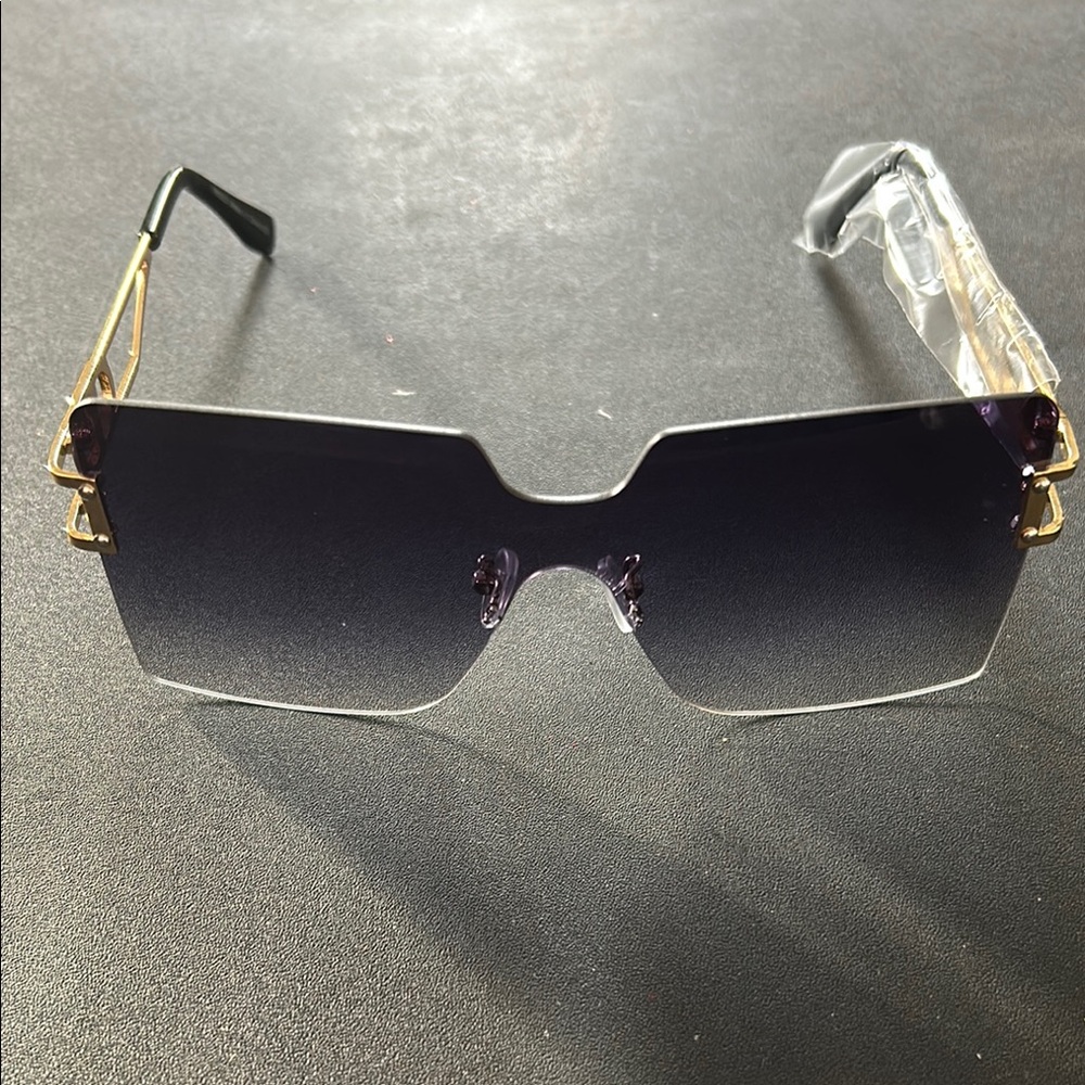 Luxurious Black and Gold Frameless Sunglasses